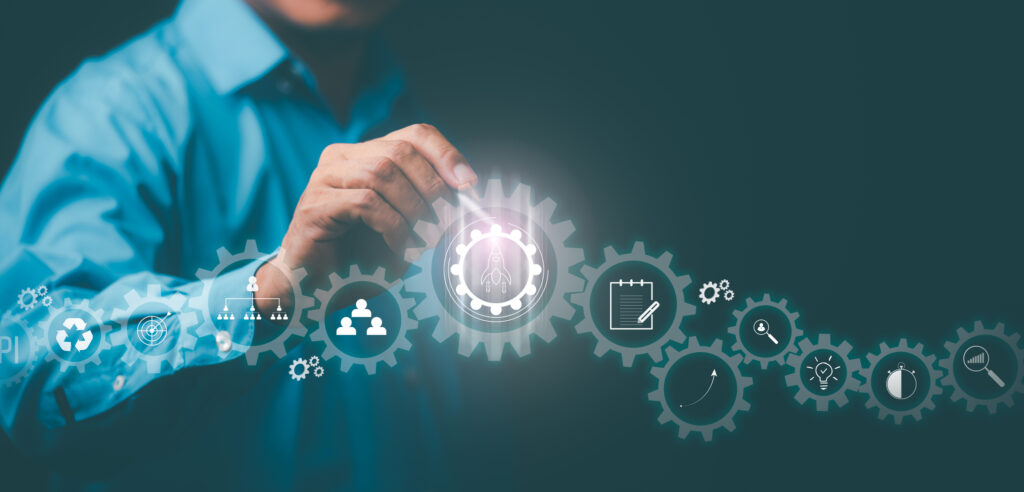 Managing and planning business processes and workflows for higher goals.Business strategy,Young businessman pointing at an icon with a pen ,Optimize business process workflow.Digital marketing.